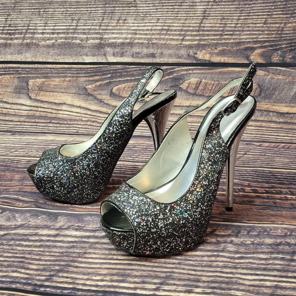 Black Platform heels with rainbow glitter. Silver heel. Size 7 from Deb.